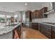 Modern kitchen featuring granite countertops, stainless steel appliances, and ample cabinetry at 26568 W Cat Balue Dr, Buckeye, AZ 85396