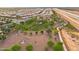 Aerial view of a community park with walking paths and green spaces at 26568 W Cat Balue Dr, Buckeye, AZ 85396