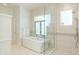 Spa-like bathroom with soaking tub, walk-in shower, and elegant tile at 3965 E Sierra Vista Dr, Paradise Valley, AZ 85253
