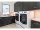 Well-equipped laundry room with modern washer and dryer, and ample counter space at 3965 E Sierra Vista Dr, Paradise Valley, AZ 85253