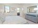 Bright bedroom with a comfortable bed, dresser, and access to a private balcony at 3965 E Sierra Vista Dr, Paradise Valley, AZ 85253