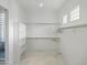 Bright walk-in closet with ample shelving and hanging space at 11905 N 83Rd Pl, Scottsdale, AZ 85260