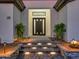 Modern home exterior with a gray double door, stone pathway, and lights at 11905 N 83Rd Pl, Scottsdale, AZ 85260