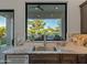 Kitchen sink with view of backyard and pool at 11905 N 83Rd Pl, Scottsdale, AZ 85260