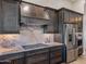 Kitchen with range, stainless steel appliances and granite countertops at 11905 N 83Rd Pl, Scottsdale, AZ 85260
