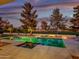 Scenic pool view at dusk, showcasing the property's tranquil ambiance at 11905 N 83Rd Pl, Scottsdale, AZ 85260