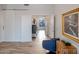 Elegant hallway with barn door, hardwood floors and view to living area at 11905 N 83Rd Pl, Scottsdale, AZ 85260