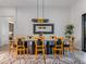 Modern dining room with a unique table and stylish chairs at 11905 N 83Rd Pl, Scottsdale, AZ 85260