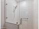 Walk-in shower with textured tile and glass enclosure at 11905 N 83Rd Pl, Scottsdale, AZ 85260