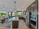Modern kitchen with large island and stainless steel appliances at 11905 N 83Rd Pl, Scottsdale, AZ 85260