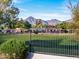 View of a golf course with mountains in the background at 11905 N 83Rd Pl, Scottsdale, AZ 85260