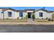 Modern single-story home with a clean, white facade at 11905 N 83Rd Pl, Scottsdale, AZ 85260