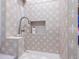 Convenient laundry room shower with patterned tile at 11905 N 83Rd Pl, Scottsdale, AZ 85260