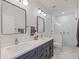 Bathroom with double vanity, modern fixtures, and a walk-in shower at 11905 N 83Rd Pl, Scottsdale, AZ 85260