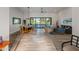 Open living room and dining area with sliding glass doors to backyard at 11905 N 83Rd Pl, Scottsdale, AZ 85260