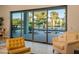 Open view of the pool and backyard through sliding glass doors at 11905 N 83Rd Pl, Scottsdale, AZ 85260