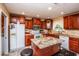 Spacious kitchen with island and granite countertops at 2508 W Roveen Ave, Phoenix, AZ 85029