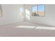 Bright bedroom with neutral carpet and large windows at 20218 W Hollyhock St, Buckeye, AZ 85396