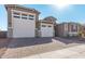 Two-story house with a three-car garage and desert landscaping at 20223 W Hollyhock St, Buckeye, AZ 85396