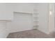 Spacious walk-in closet with shelving and hanging rods at 20223 W Hollyhock St, Buckeye, AZ 85396