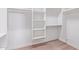 Large walk-in closet with built-in shelving at 25843 W Northern Lights Way, Buckeye, AZ 85326