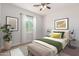 Bedroom with window and ceiling fan at 25843 W Northern Lights Way, Buckeye, AZ 85326