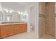 Double vanity bathroom with walk-in shower at 25843 W Northern Lights Way, Buckeye, AZ 85326