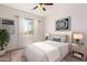 Bedroom with window and ceiling fan at 25843 W Northern Lights Way, Buckeye, AZ 85326