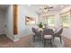 Dining area with wood beam accent and seating for six at 25843 W Northern Lights Way, Buckeye, AZ 85326