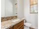 Bathroom with granite countertop and updated fixtures at 25843 W Northern Lights Way, Buckeye, AZ 85326