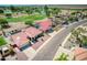 Single-story home with a red tile roof, pool, and golf course view at 2119 N Lake Shore Dr, Casa Grande, AZ 85122