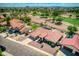 Single-story home with red tile roof, pool, and mountain views at 2119 N Lake Shore Dr, Casa Grande, AZ 85122