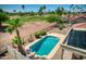 Relaxing backyard oasis with a sparkling pool, surrounded by lush landscaping and a golf course view at 2119 N Lake Shore Dr, Casa Grande, AZ 85122