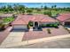 Single-story home with red tile roof and landscaped yard at 2119 N Lake Shore Dr, Casa Grande, AZ 85122