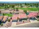 Single-story home with red tile roof, pool, and golf course view at 2119 N Lake Shore Dr, Casa Grande, AZ 85122