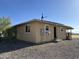 Rear view of house with solar panels at 7801 S 547Th Ave, Tonopah, AZ 85354