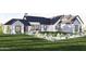 Stunning farmhouse exterior with brick accents, landscaping, and a spacious yard at 0 N Marchant Trace --, Queen Creek, AZ 85144