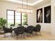Bright dining room showcasing a marble dining table and large windows overlooking the backyard at 0 N Marchant Trace --, Queen Creek, AZ 85144