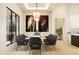 Elegant dining room with a large marble table and statement horse artwork at 0 N Marchant Trace --, Queen Creek, AZ 85144