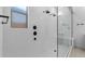 Walk-in shower with subway tile and built-in bench at 37607 W Padilla St, Maricopa, AZ 85138