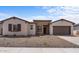 New single story home with a two-car garage and stone accents at 37607 W Padilla St, Maricopa, AZ 85138