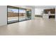 Open living area with sliding doors leading to the backyard at 37607 W Padilla St, Maricopa, AZ 85138