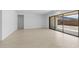Bright and airy living room with sliding glass doors to patio at 37607 W Padilla St, Maricopa, AZ 85138