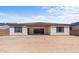 Rear view of single-story house with covered patio at 37607 W Padilla St, Maricopa, AZ 85138