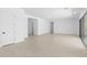Spacious living room with light wood floors and access to patio at 37607 W Padilla St, Maricopa, AZ 85138