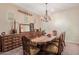 Elegant dining room with ornate furniture and geometric wallpaper at 3314 E Azalea Dr, Gilbert, AZ 85298