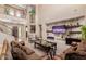 Bright and airy living room with fireplace and large TV at 3314 E Azalea Dr, Gilbert, AZ 85298