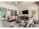 Cozy covered patio with comfortable seating and a fireplace at 3314 E Azalea Dr, Gilbert, AZ 85298