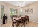 Bright dining room with large windows and wooden table at 3314 E Azalea Dr, Gilbert, AZ 85298