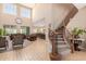 Spacious living room featuring high ceilings and a curved staircase at 3314 E Azalea Dr, Gilbert, AZ 85298